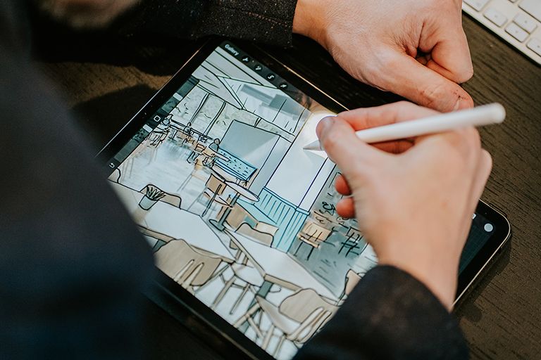 Graphic designer sketching on an ipad